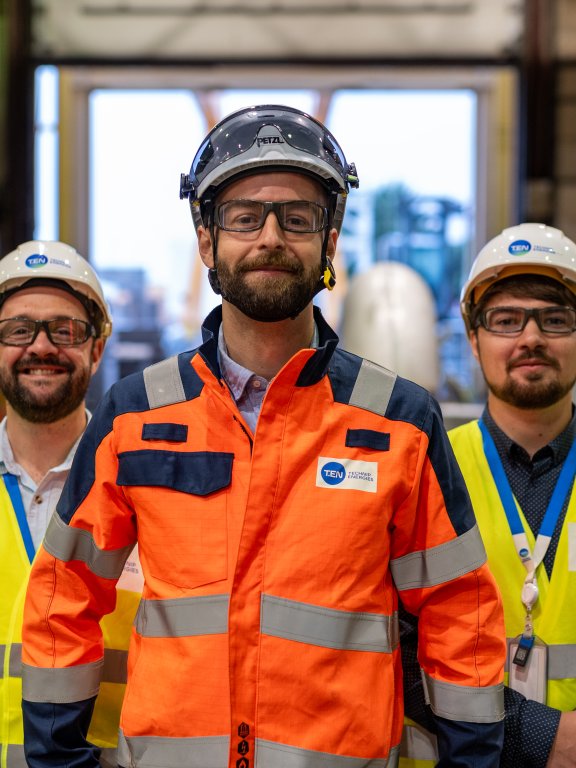 Three Technip Energies employees onsite wearing safety gear