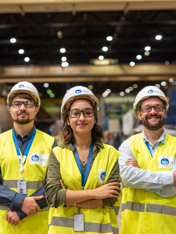 Three Technip Energies employees onsite wearing safety gear