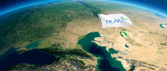 TKJV banner image representing the Earth (cropped to show the Middle East) on a blue background, with a flag "TKJV" planted in the Kazakhstan