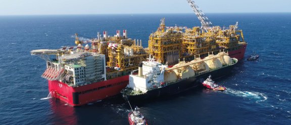Two boats loading and unloading energy on the open sea