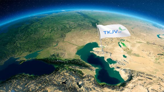 TKJV banner image representing the Earth (cropped to show the Middle East) on a blue background, with a flag "TKJV" planted in the Kazakhstan