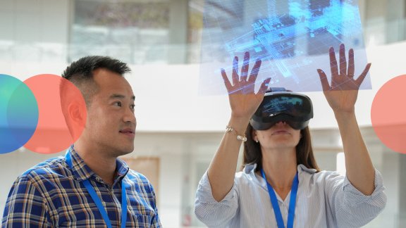 Technip Energies employees interacting with virtual reality using virtual reality goggles