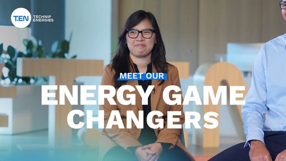 Woman seated in a modern office setting and the text ‘Meet Our Energy Game Changers’ displayed.